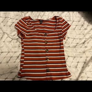 Striped shirt with buttons down the middle